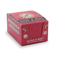 Close-up of Beessential Rose Mint Lip Balm tube. Pure rose oil and peppermint for refreshed lips.