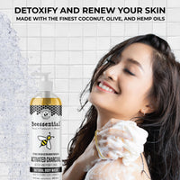 Person washing with 16 oz bottle of Activated Charcoal Body Wash with rich natural foam.