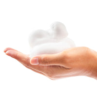 Rich, zesty foam of Beessential Grapefruit and Lemongrass Foaming Hand Soap in hand.