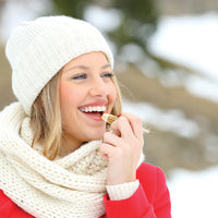 Woman applying Natural Beeswax Honey Lip Balm